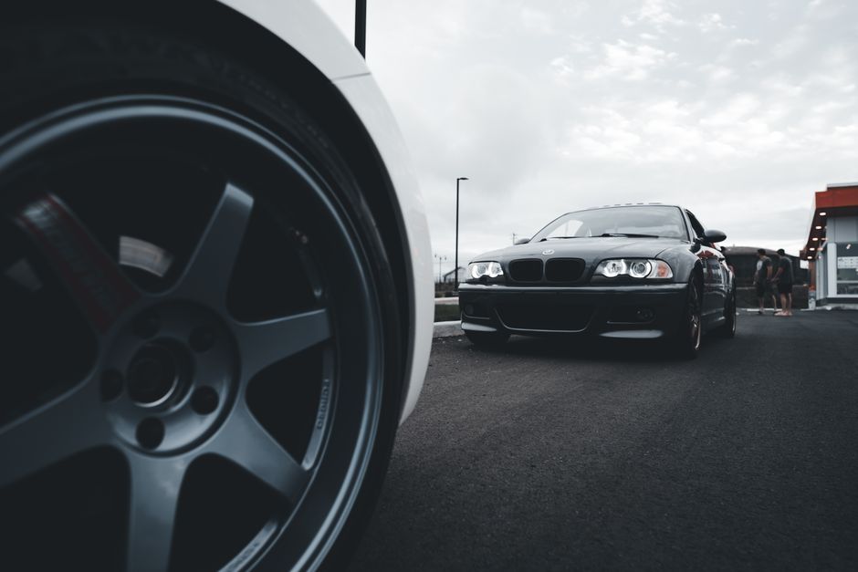Dynamic shot of sleek sports cars on a wide asphalt road
